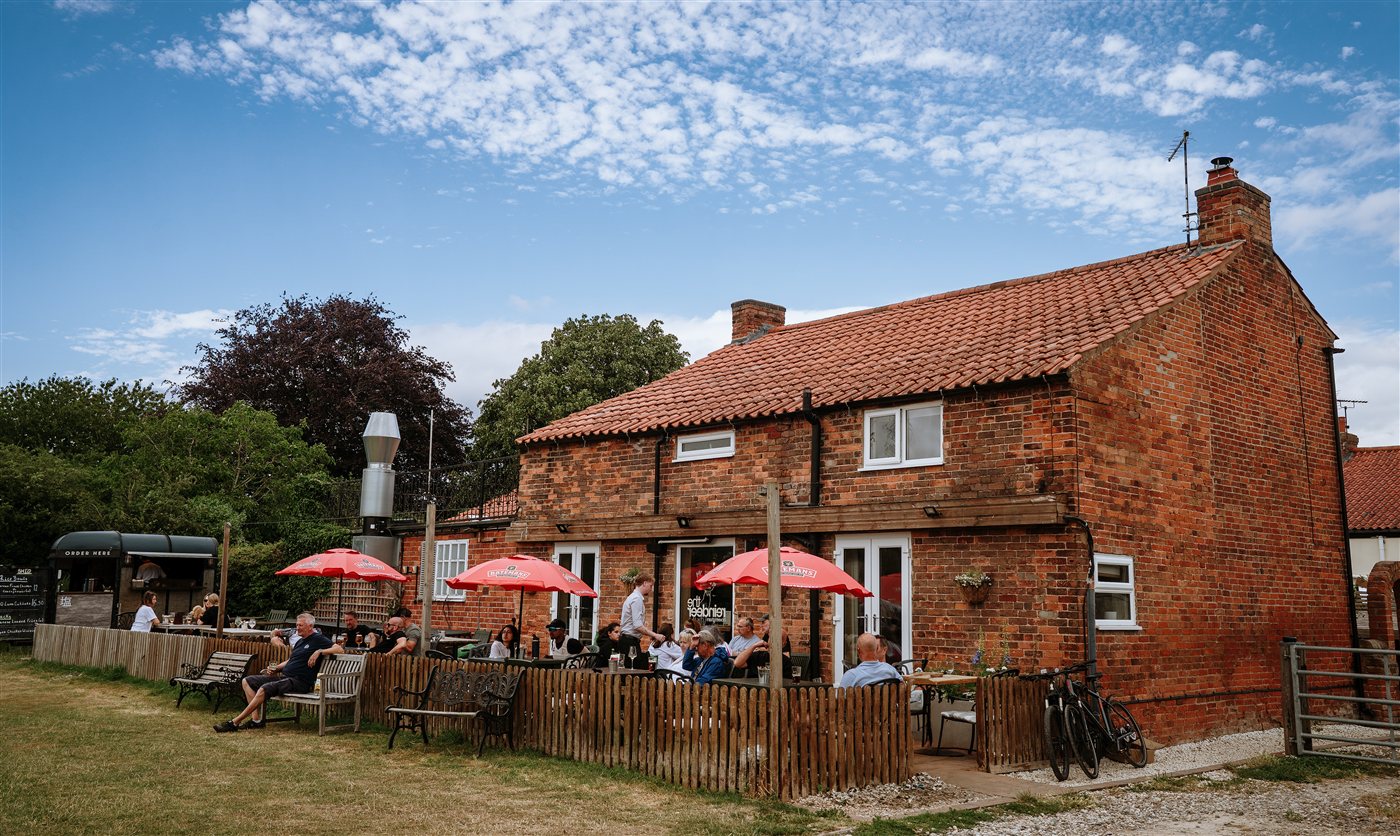 The sun terrace at The Reindeer Hoveringham overlooking the cricket ground